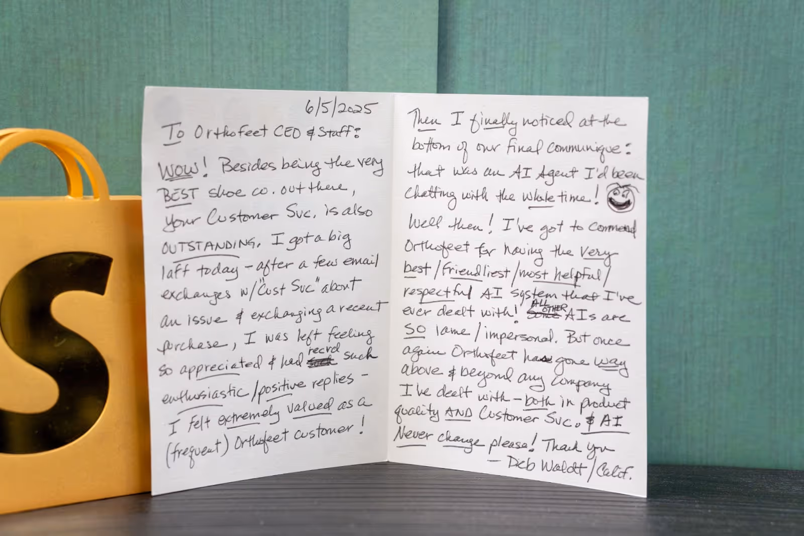 Handwritten thank-you note praising Orthofeet's customer service and AI Agent for being helpful, friendly, and responsive.