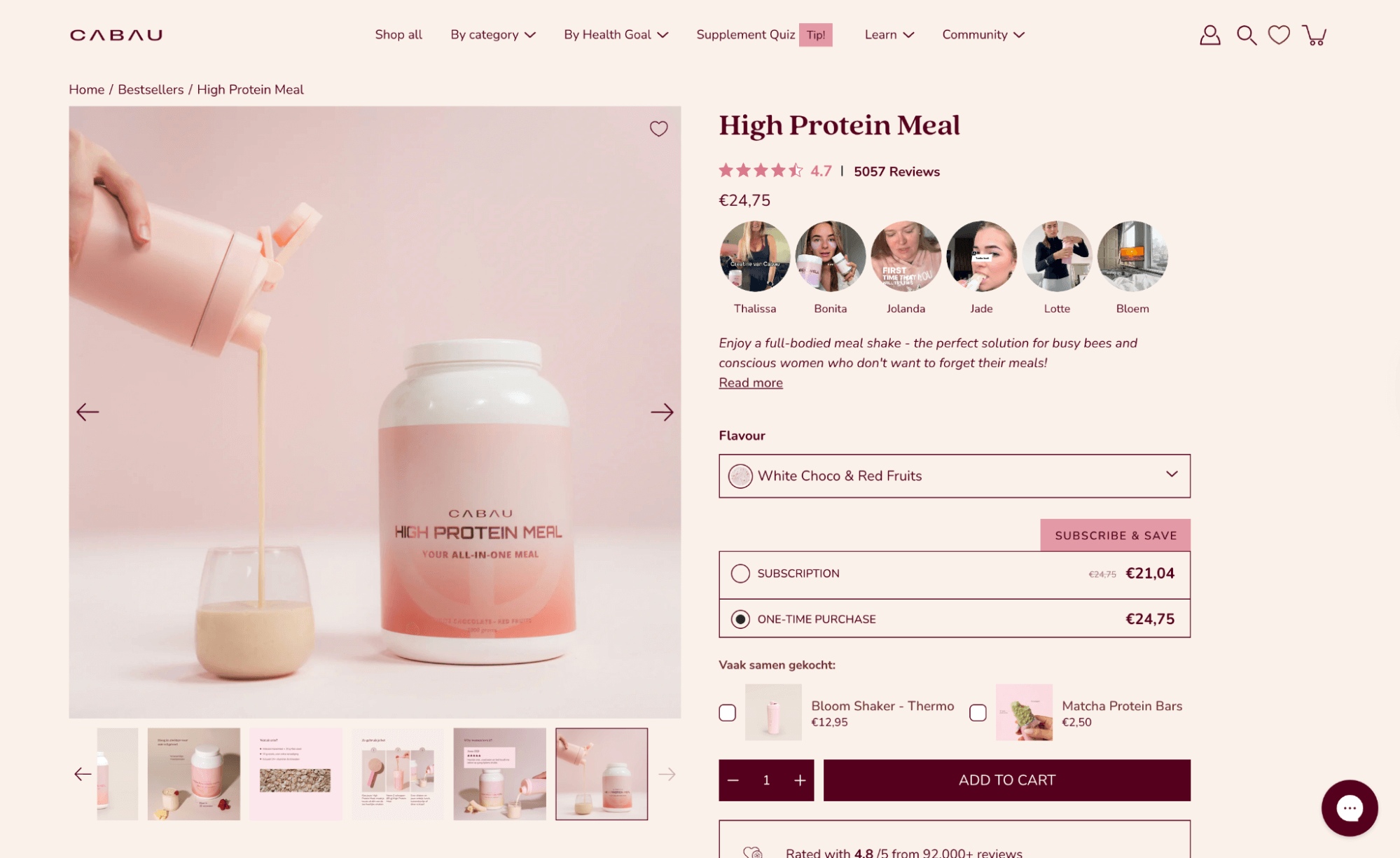 Protein shake being poured into a glass beside a Cabau High Protein Meal container on a soft pink background.
