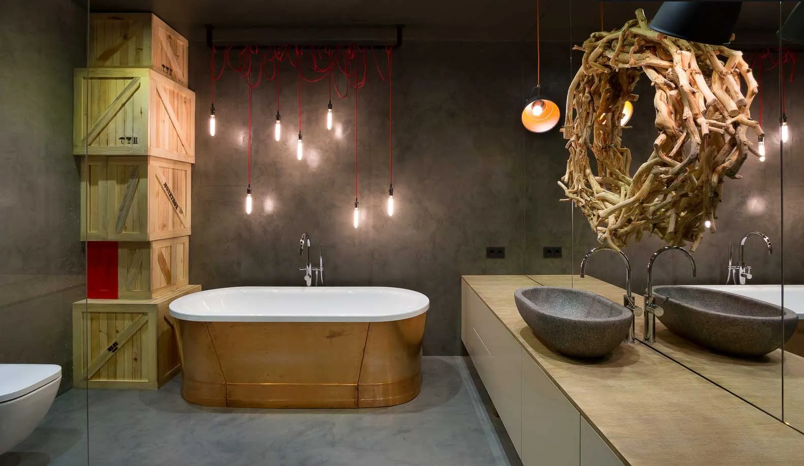 Bathroom with dark grey microcement walls and floor, wooden bath and stone basins