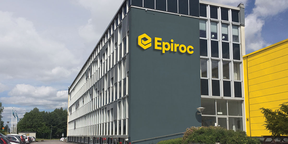 The yellow Eprico logo on the side of a grey building. 