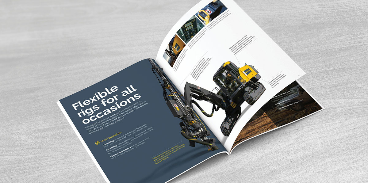 Epiroc literature opened up to show a picture of mining equipment on the inside.