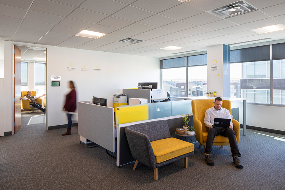 employees working in small gathering spaces