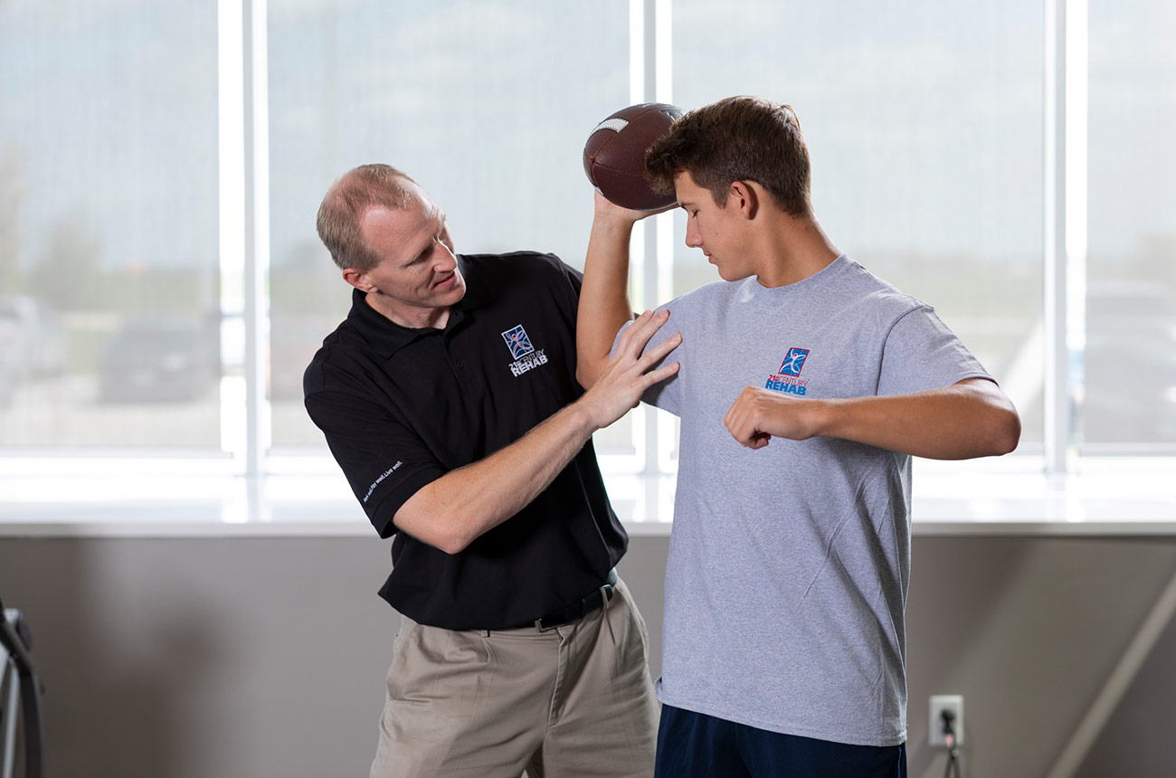 football player doing physical therapy