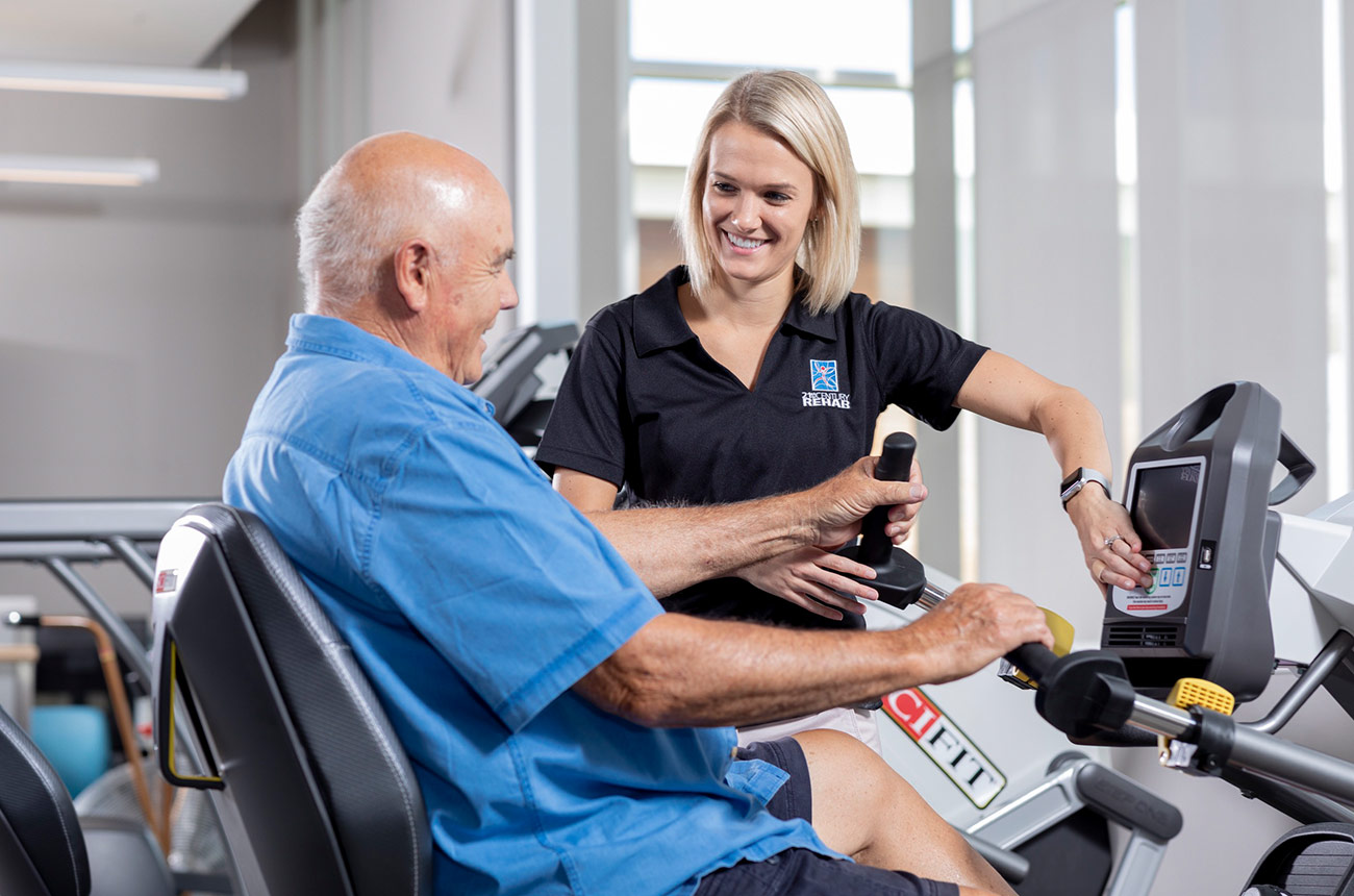 older man doing physical therapy