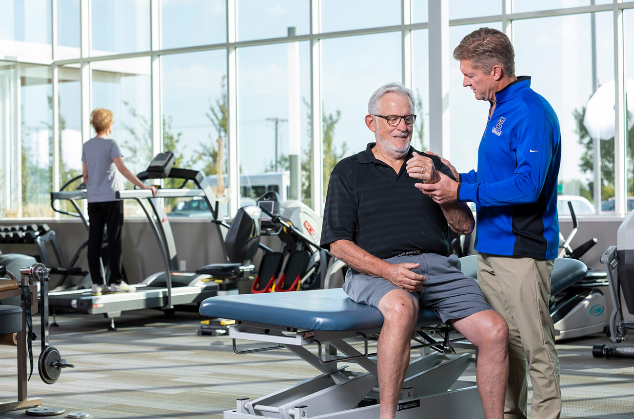 older man doing physical therapy