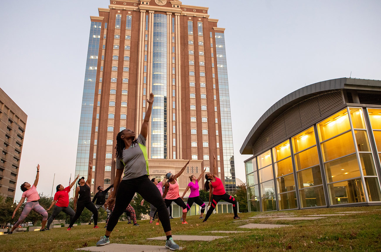 people doing outdoor yoga