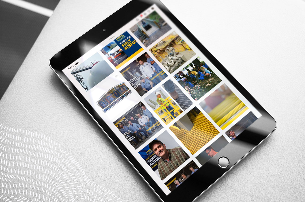 iPad laying on a table with a grid of social posts on the screen.