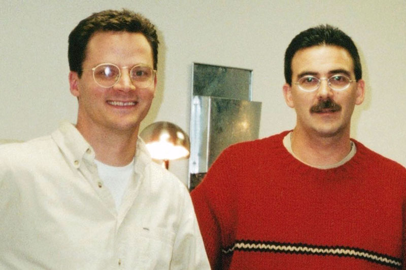 Two men with glasses, Jeff and Jim, smiling and standing side by side.
