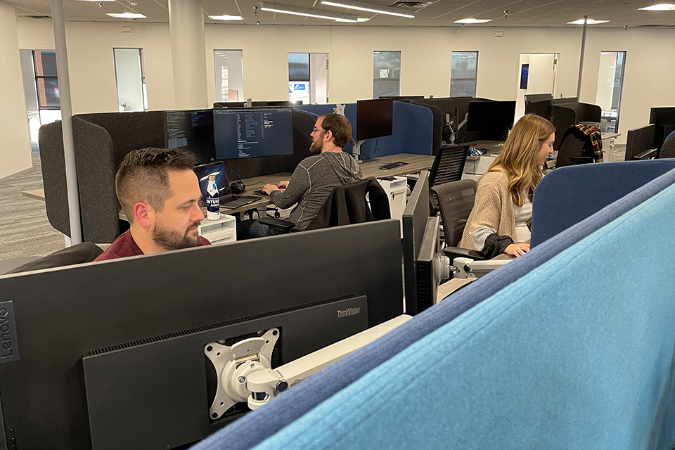 Anthologic employees working at desks.
