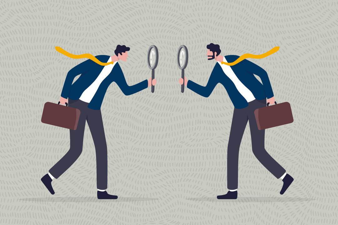 An illustration of two men with magnifying glasses examining each other. They are each dressed in business attire. 