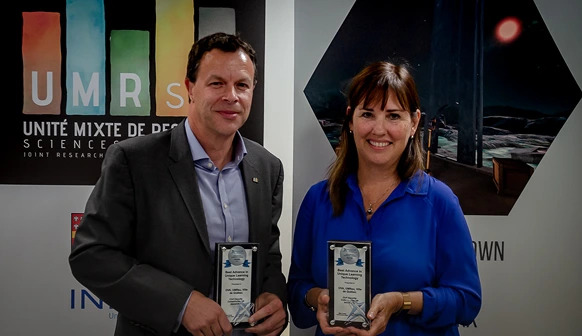 Lucie Rivard, COO of OVA, holding an award