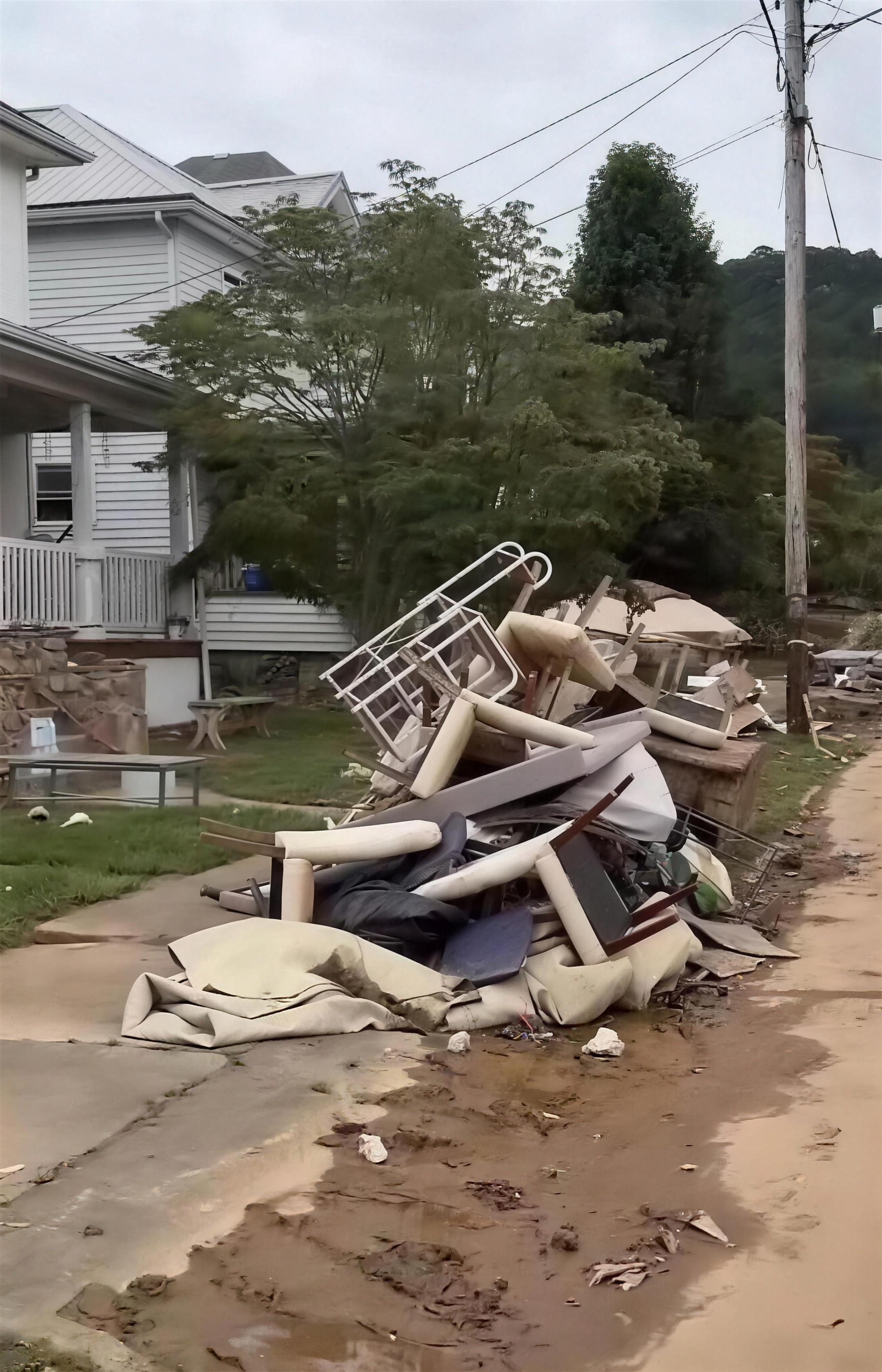 Pile of flood-damaged household belongings in West Virginia