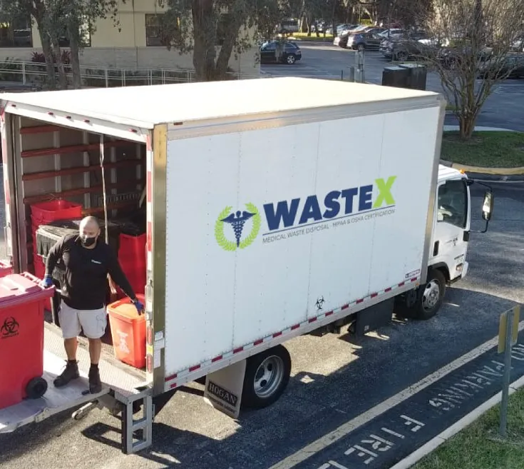 WasteX team and branded medical waste service truck