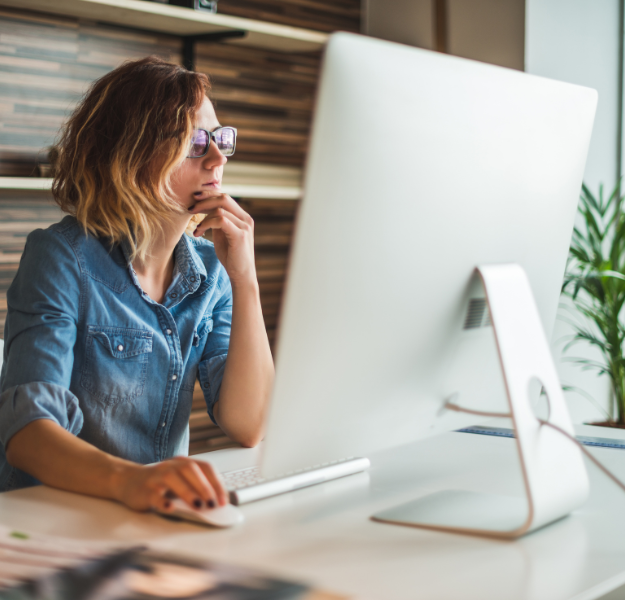 Woman focusing on computer screen