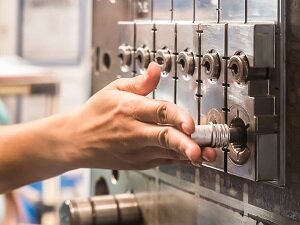 Worker Operating Industrial Machine