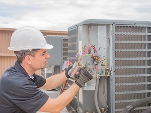 Electrician Working on Equipment