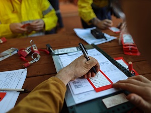 Workers Filling Out Tags for Lockout