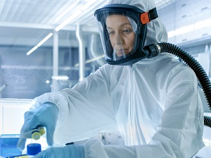 Lab worker wearing respiratory protection.