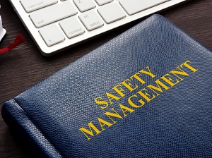 A folder on a work desk that says Safety Management.