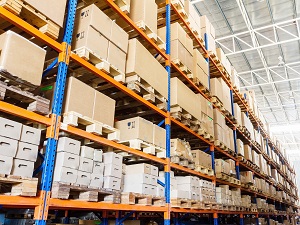 Steel racking with palletized materials stacked neatly in a warehouse.