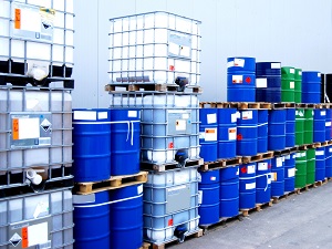 Hazardous materials in barrels stored outside.