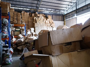 Warehouse with boxes stacked dangrously.