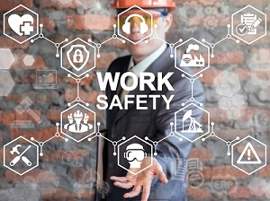 A worker wearing a hard hat with work safety icons superimposed onto his image as a representation of workplace safety.