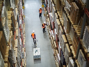 Warehouse workers wearing PPE.