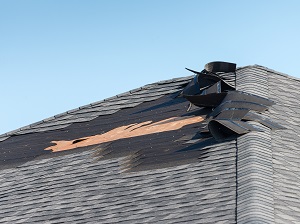 A damaged roof in need of repair.