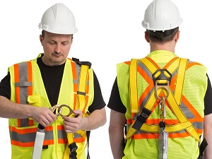 Construction worker demonstrating a fall protection harness.