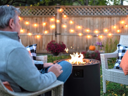Adult Person Enjoying a Backyard Fire