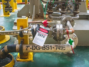 Industrial equipment with lockout and tagout devices attached.