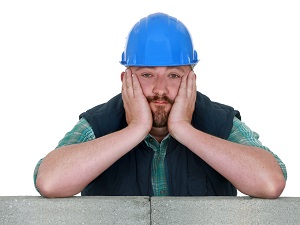 A construction worker who looks really bored.
