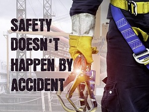 A worker wearing fall protection with the phrase, "Safety Doesn't Happen by Accident."