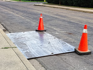 Strong Cover Over Hole on Residential Street