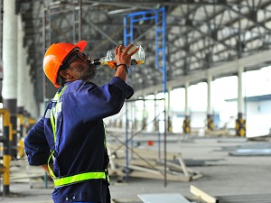 Construction Worker Drinking Alcohol During Work Day