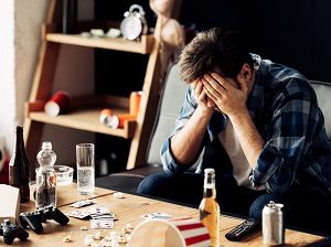 Man at Home, Upset by Drug and Alcohol Consumption