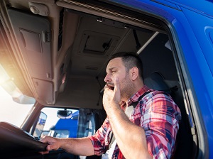 Truck Driver Yawning While Driving