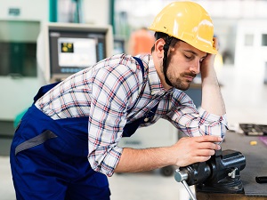 Industrial Worker Falling Asleep at Work