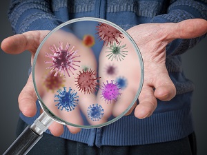 Magnifying glass demonstrates that we all have germs on our hands.