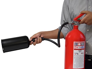 Person Holding a Portable Fire Extinguisher, Ready to Use