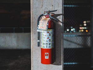 Fire Extinguisher on Concrete Post