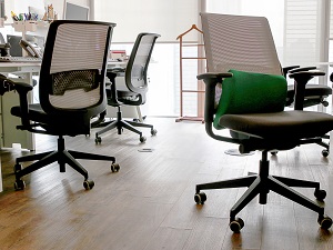 Several office chairs in an open office environment.