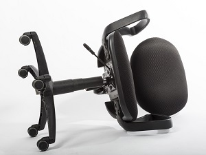 A black office chair that has tipped over on a white background.
