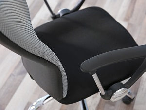 A view of a black office chair from above.