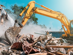 An excavator assisting demolition activities.