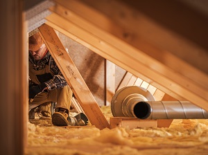 A worker in an attic.
