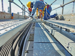 Workers installing new cable trays.
