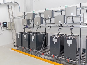 Battery charging station inside an industrial workplace.
