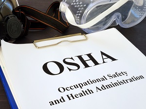 A clipboard with a piece of paper on it that says, "OSHA Occupational Safety and Health Administration."